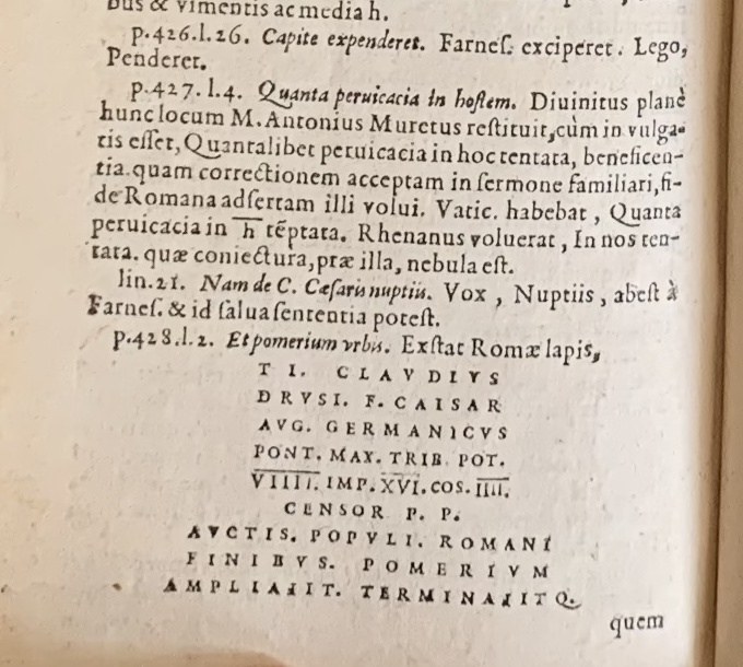 Audley End Tacitus (1574), p. 720: the Claudius boundary inscription. Shown with the surrounding printed commentary.